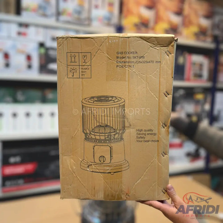 Cardboard box for a gas cooker with shipping labels and an illustration of the appliance.