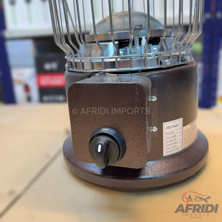 A brown and black portable electric heater with a metal grill, featuring an on/off switch.