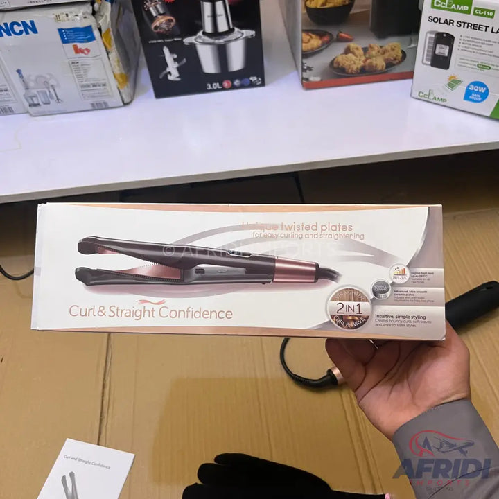 Hair curler and straightener in its packaging.