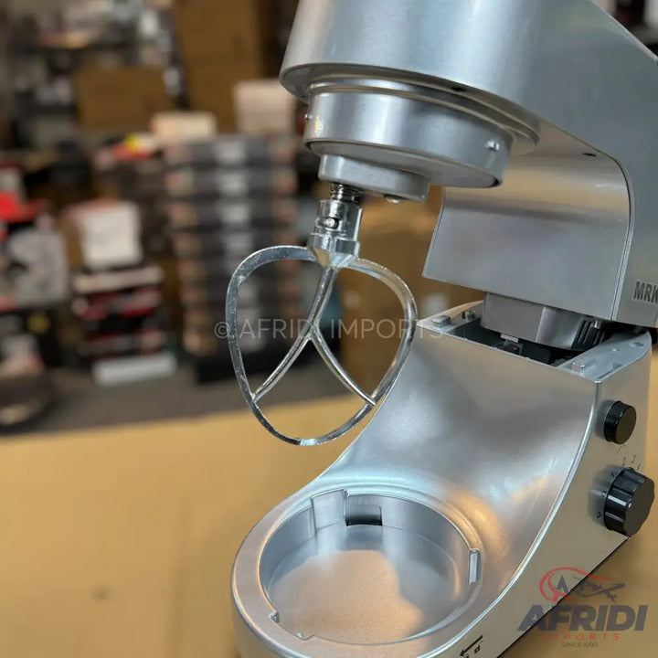 Silver-colored stand mixer with a beater attachment.