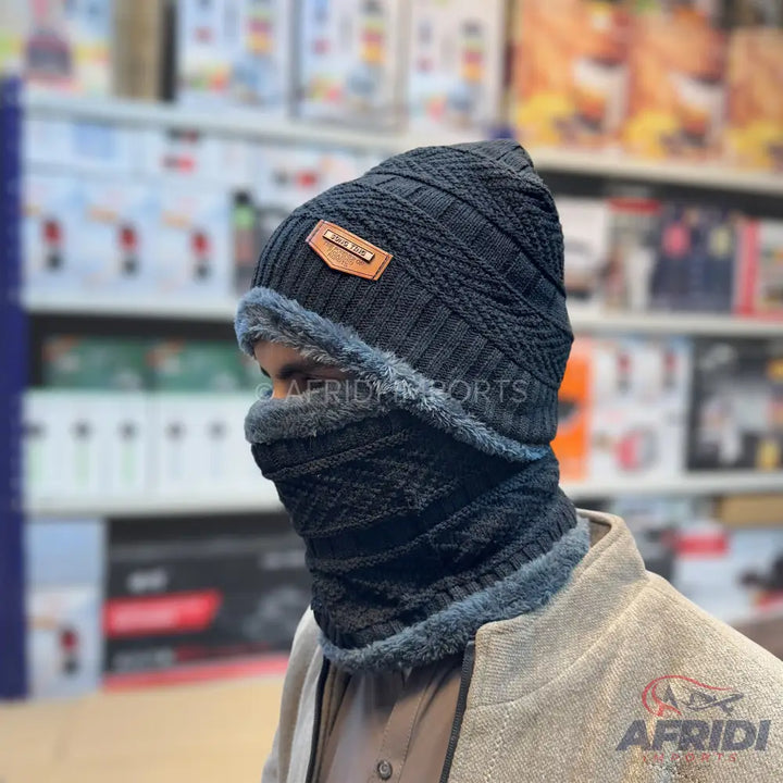 Black knit beanie and neck warmer set with a fur lining.