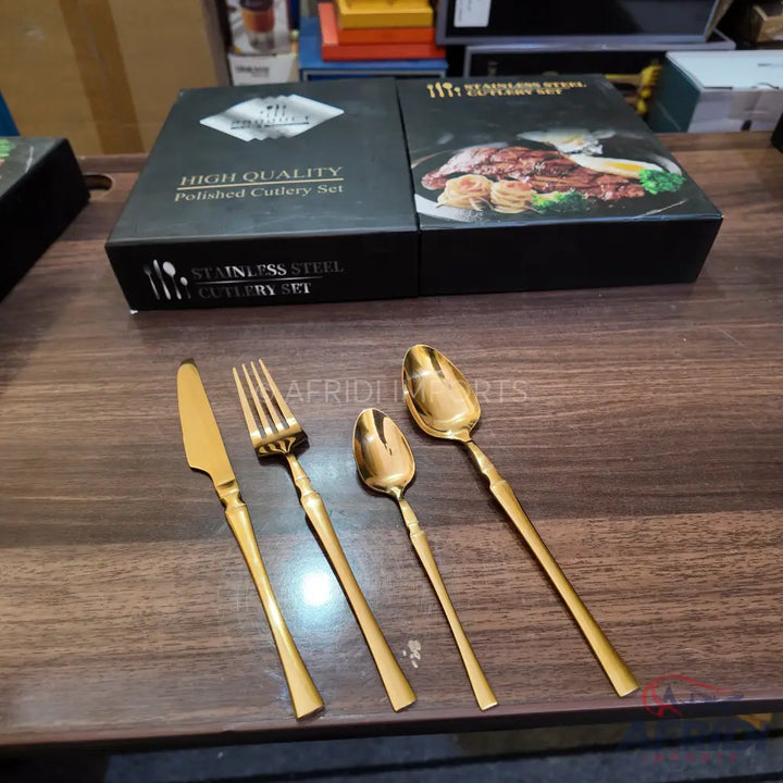 A set of gold-colored stainless steel cutlery.