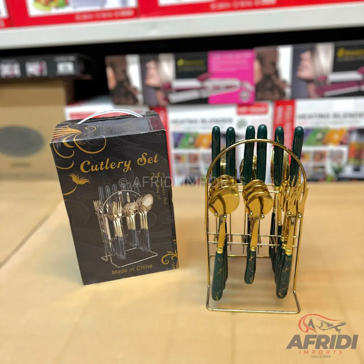 A 24-piece gold and dark green cutlery set with a display stand.