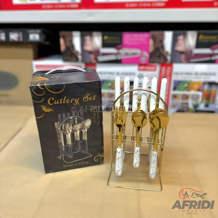 Gold and white marble cutlery set with a stand.