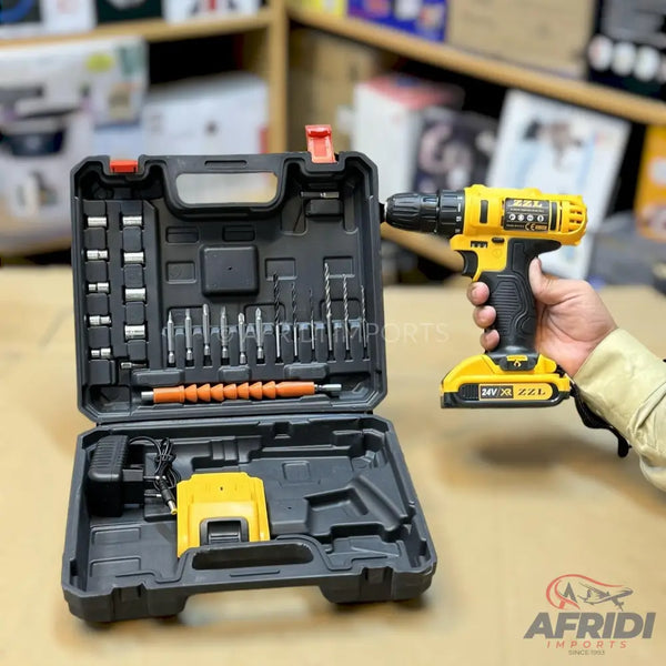 A yellow and black cordless drill with a complete drill bit and socket set in a carrying case.