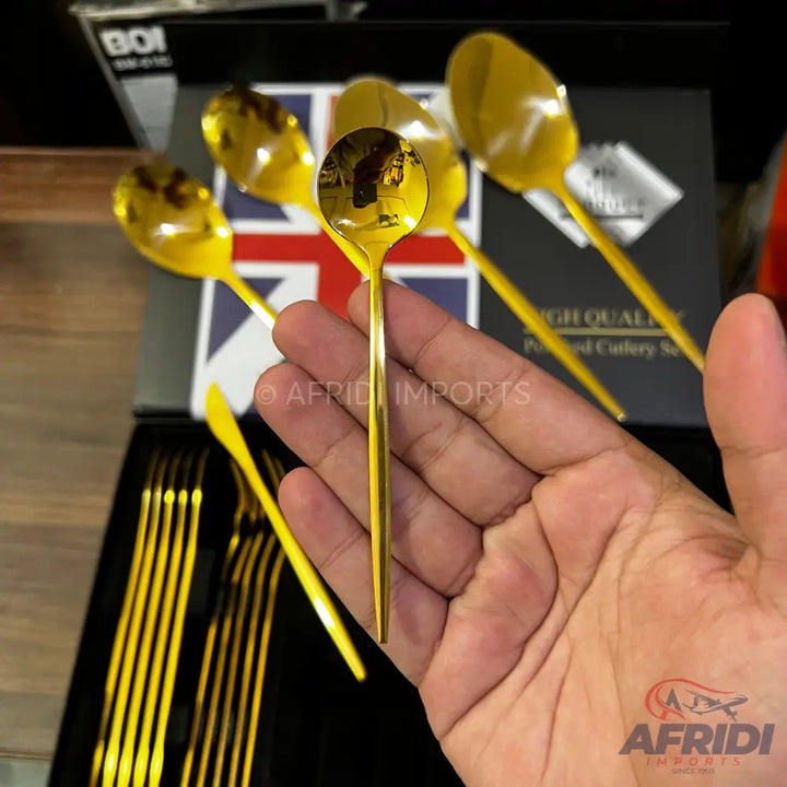 Shiny gold-colored spoon.