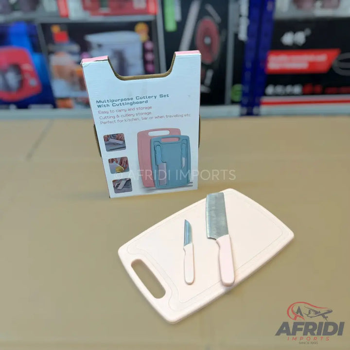 A multipurpose cutlery set with a cutting board.