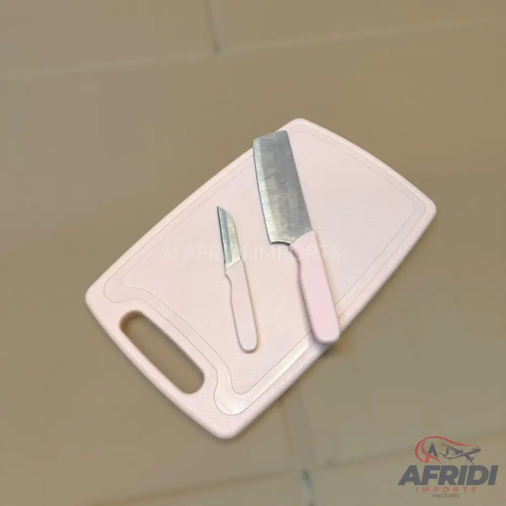 A light pink plastic cutting board with two knives.