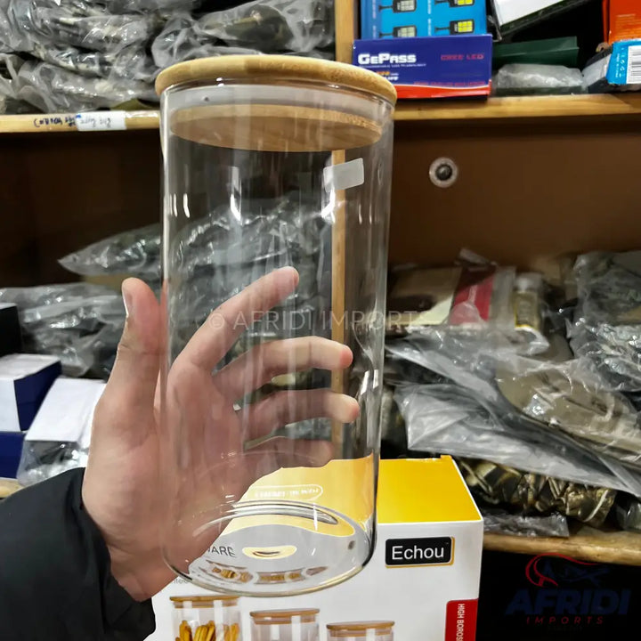 A clear glass storage jar with a bamboo lid.