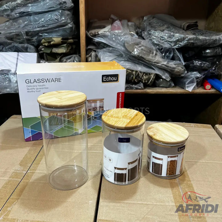 Three clear glass jars with wooden lids.