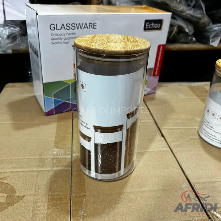 Clear glass food storage jar with a light brown bamboo lid.
