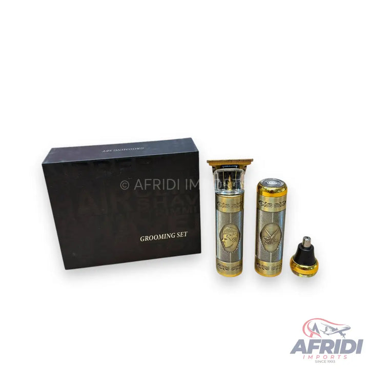 A grooming set including two ornate trimmers and a nose hair trimmer attachment, packaged in a black box.