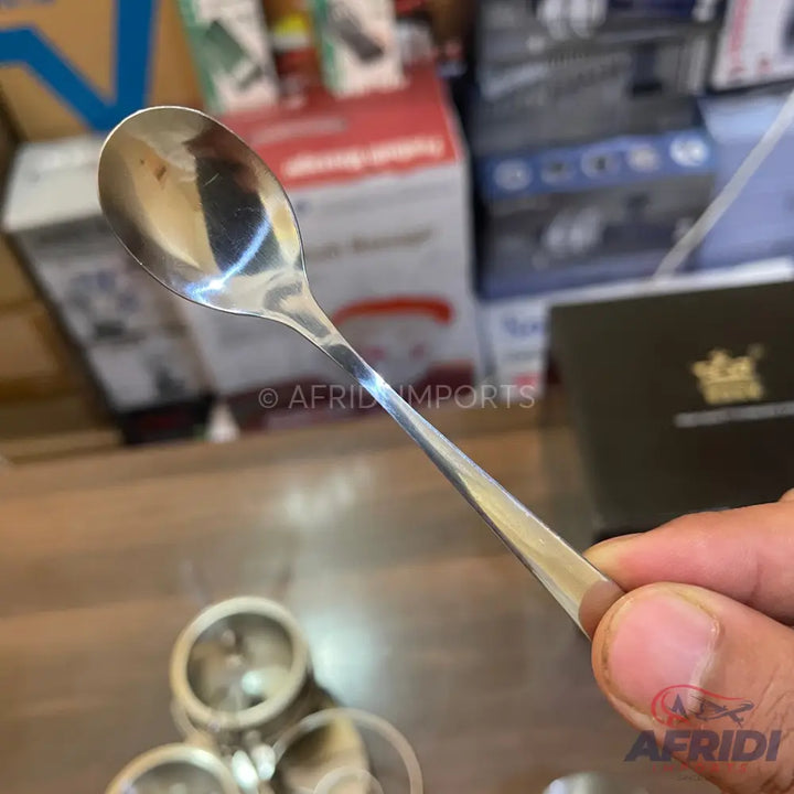A shiny, silver-colored metal spoon.