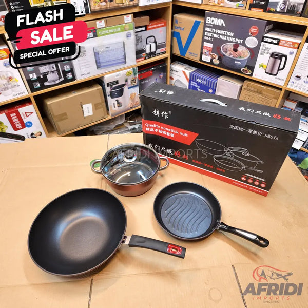 A set of cookware, including a nonstick wok, a grill pan, and a pot with a glass lid.