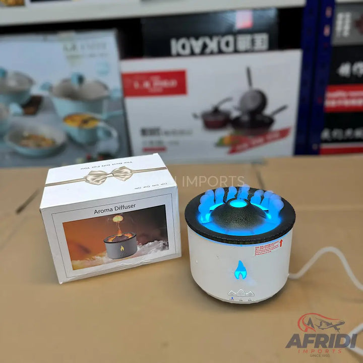 A white essential oil diffuser with a blue flame-like LED light.