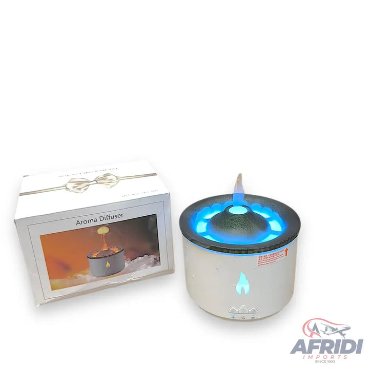 White aroma diffuser with blue LED light and flame-like mist.