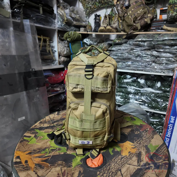A tan tactical backpack with multiple compartments and MOLLE webbing.