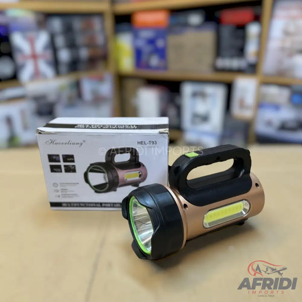 A bronze-colored rechargeable flashlight with a black handle and a green button, featuring both a main front light and a side COB light.