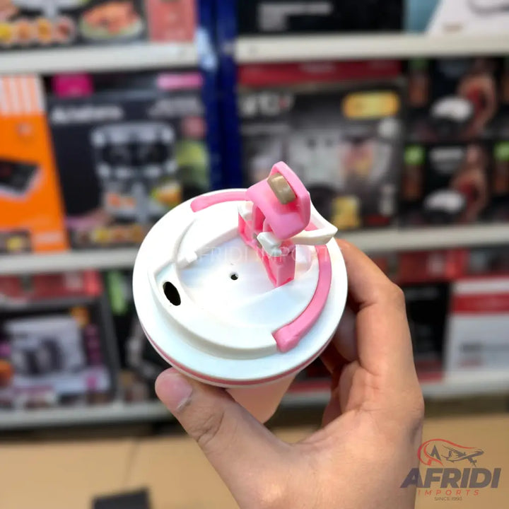 A white and pink plastic bottle cap with a flip-top drinking spout.