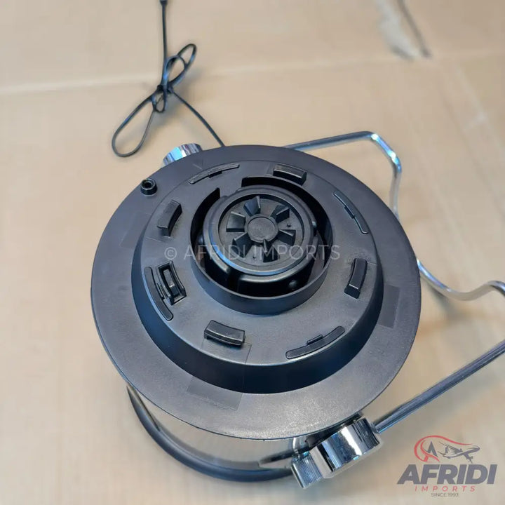 Black blender motor base with a circular drive socket and chrome-colored handles.