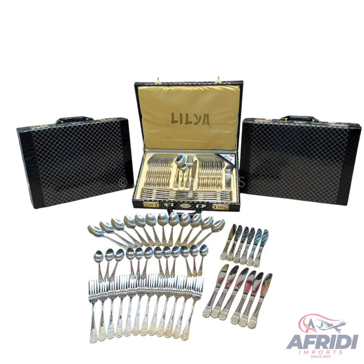 A complete set of silverware, including forks, spoons, and knives, presented in three ornate carrying cases.