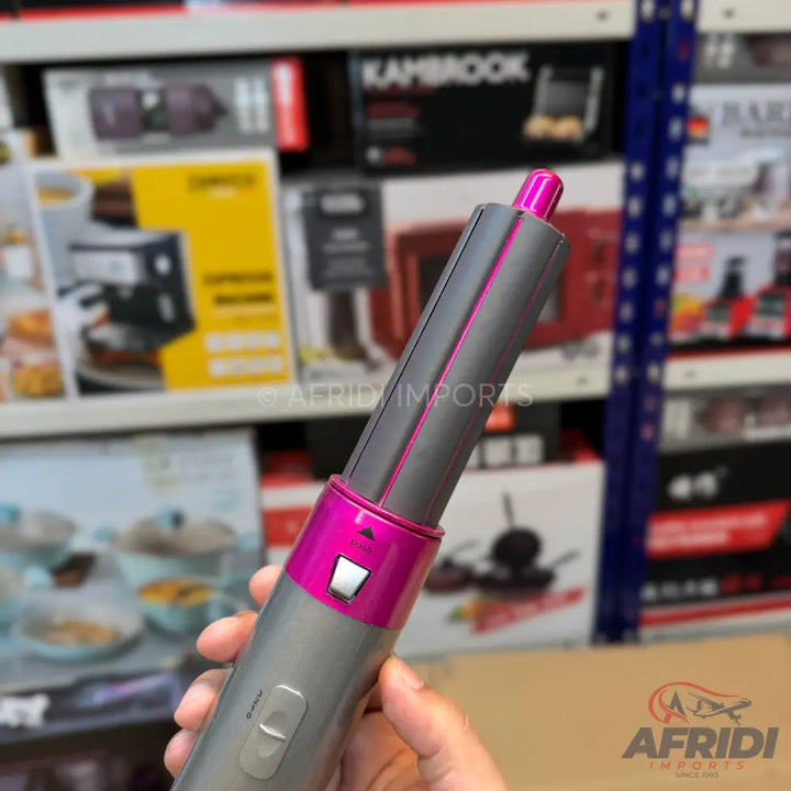 Gray and pink multi-styler hair tool.
