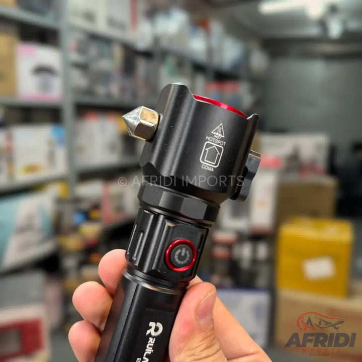 Black tactical flashlight with a red power button and a pointed glass-breaking tip.