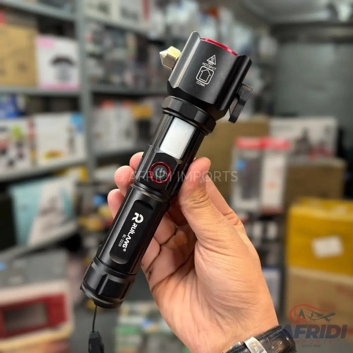 Black multi-function tactical flashlight with a side COB light, a red warning light, and a window breaker.