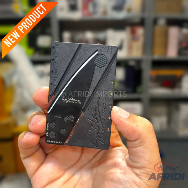 A black credit card-sized folding knife.