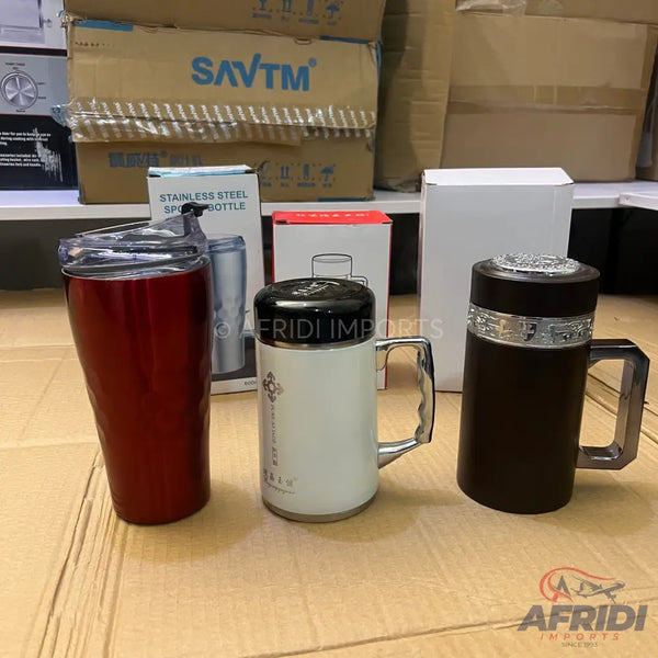 Three insulated travel mugs in red, white, and brown.