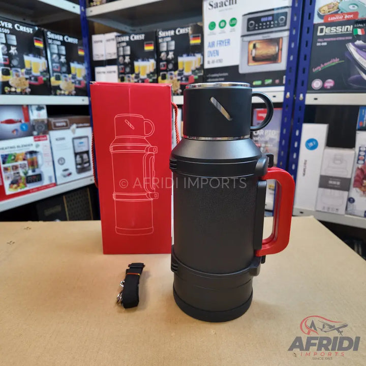 Black and red insulated thermos with a carrying handle and a strap.