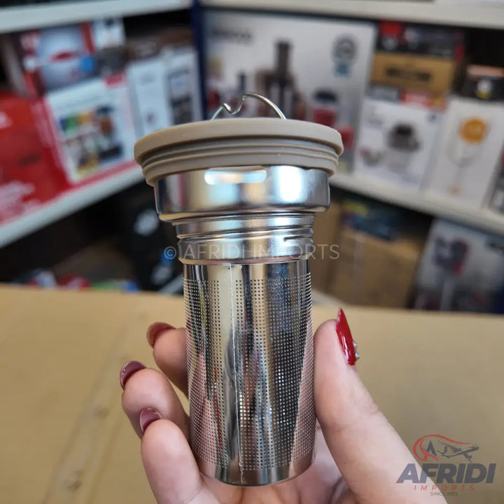 Stainless steel tea infuser with a silicone lid.