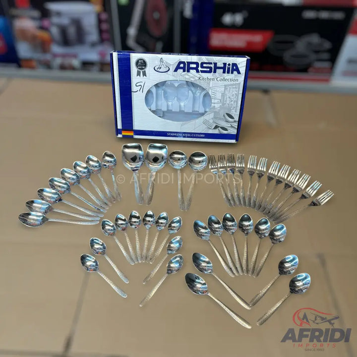 A boxed set of stainless steel cutlery, including spoons and forks.