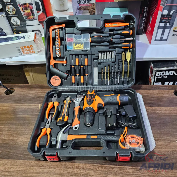 A comprehensive two-tier orange and black tool kit, including a cordless drill, various hand tools, screwdrivers, drill bits, and fasteners, neatly organized in a portable case.