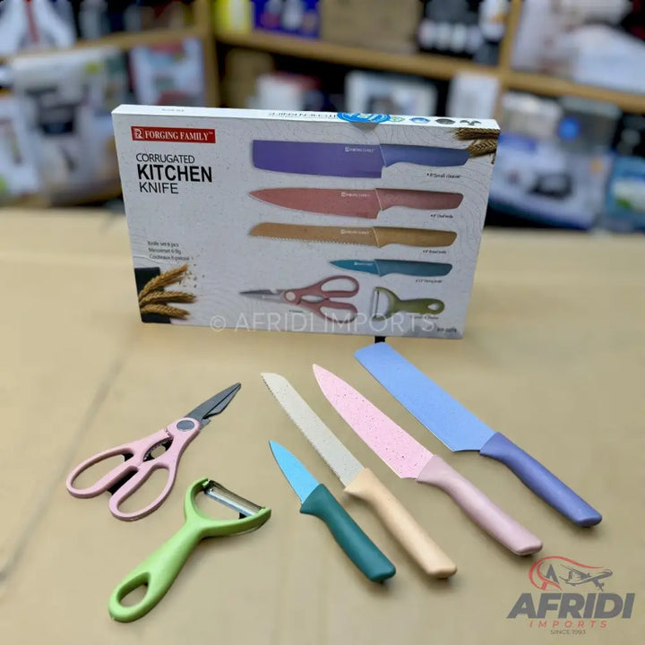 A colorful kitchen knife set with various blades, a peeler, and scissors.