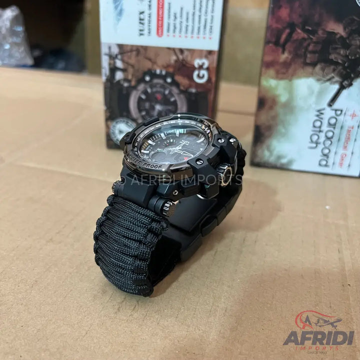 Black tactical watch with a paracord band.