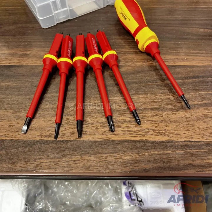 A set of red and yellow insulated screwdrivers.