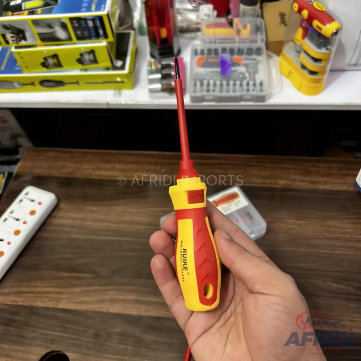 Red and yellow insulated screwdriver with a black tip.