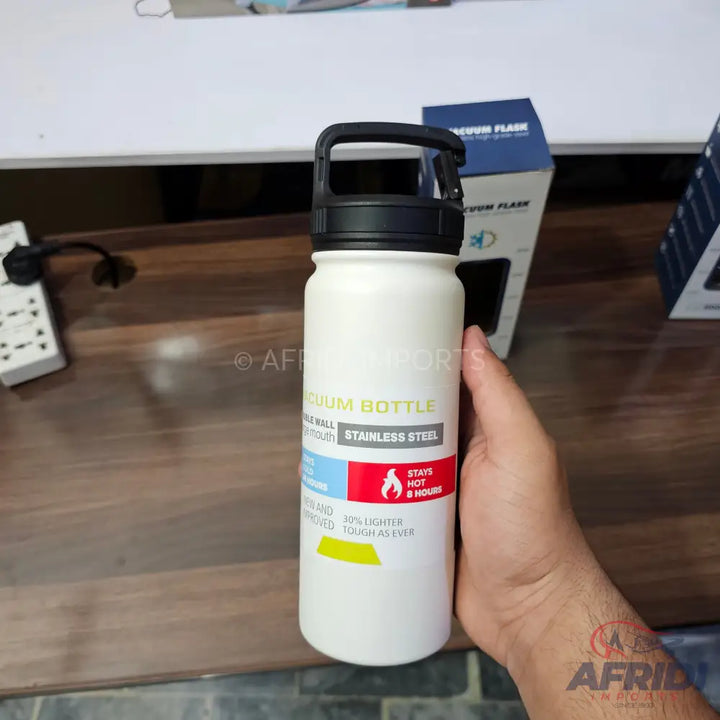 White stainless steel vacuum bottle with a black flip-top lid and handle.
