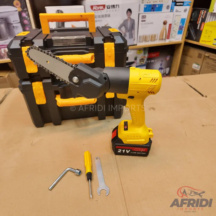 A yellow and black cordless electric chainsaw attachment for a drill, with a battery and several tools.