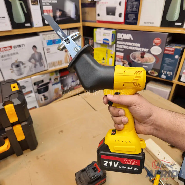 Yellow and black cordless reciprocating saw with a 21V Li-ion battery.