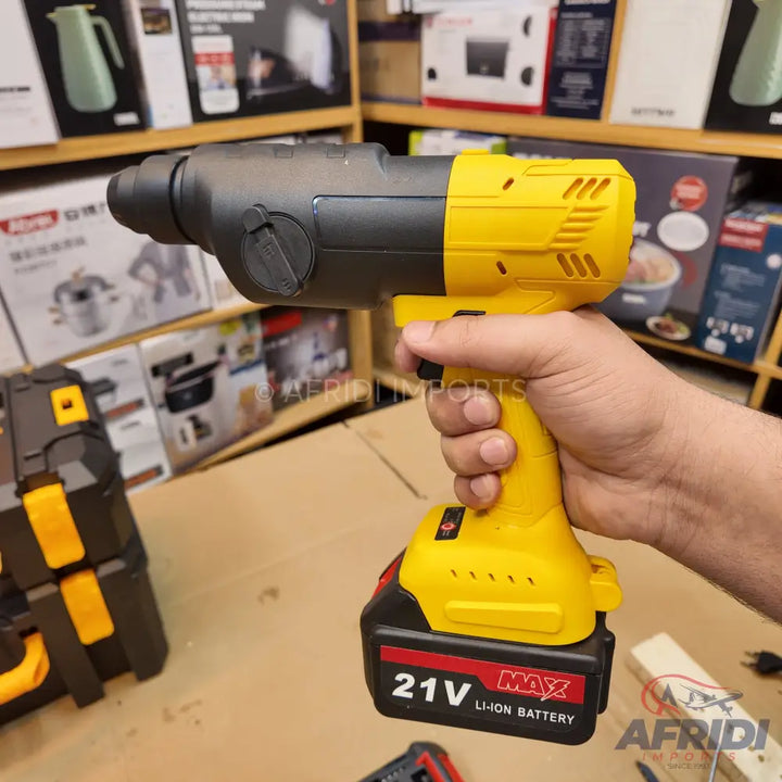 Cordless yellow and black rotary hammer drill with a 21V Li-ion battery.