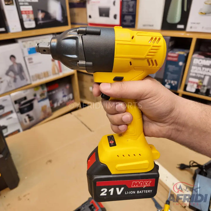 Yellow and black cordless impact wrench with a 21V Li-ion battery.