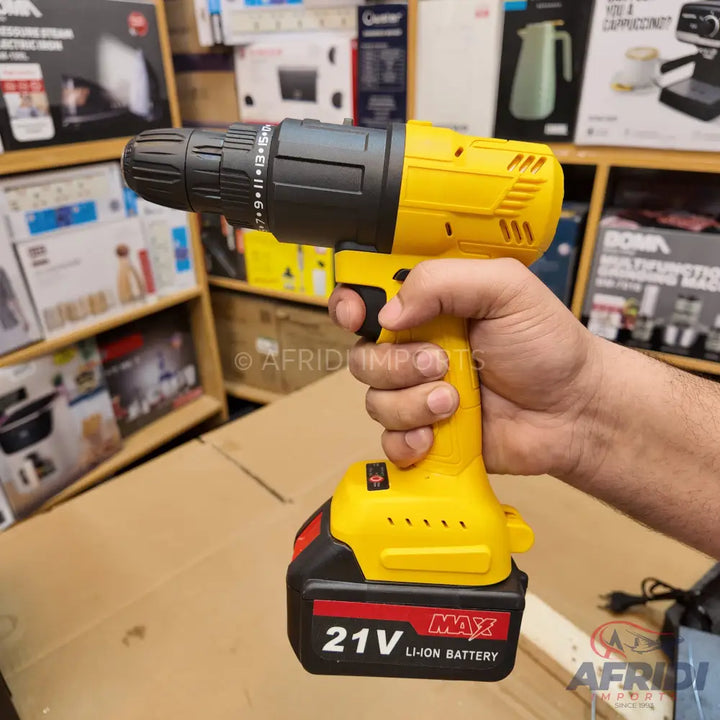 Yellow and black cordless drill with a 21V Li-ion battery.