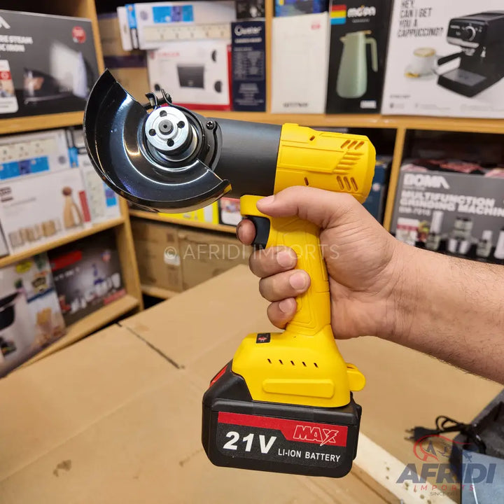 A cordless yellow and black angle grinder with a 21V Li-ion battery.