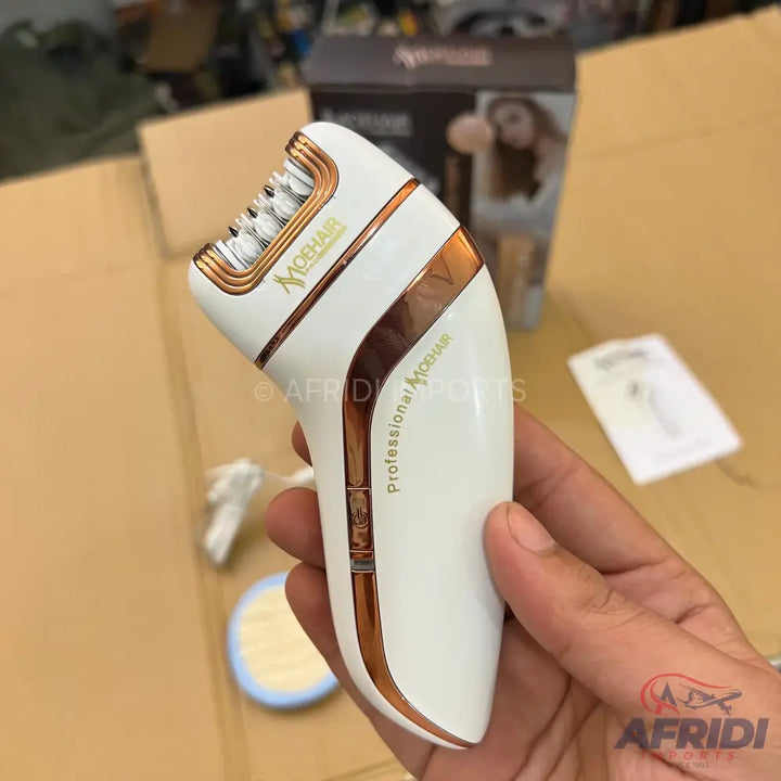 A white and rose gold electric epilator with a textured grip.