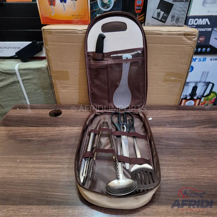 A portable cooking utensil set in a brown and beige carrying case.