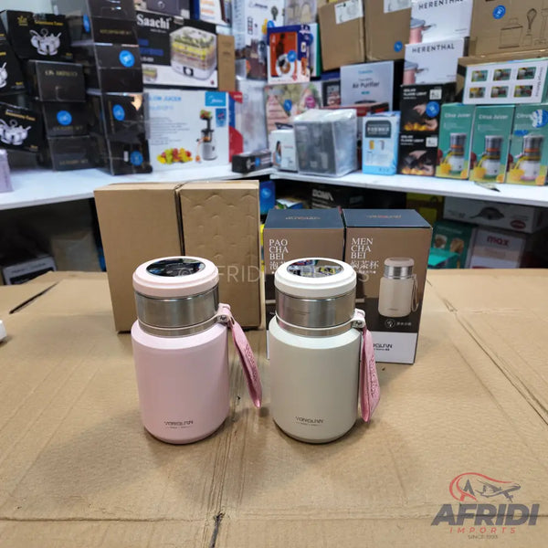 Two insulated water bottles in pink and beige, with a digital temperature display on the lid.