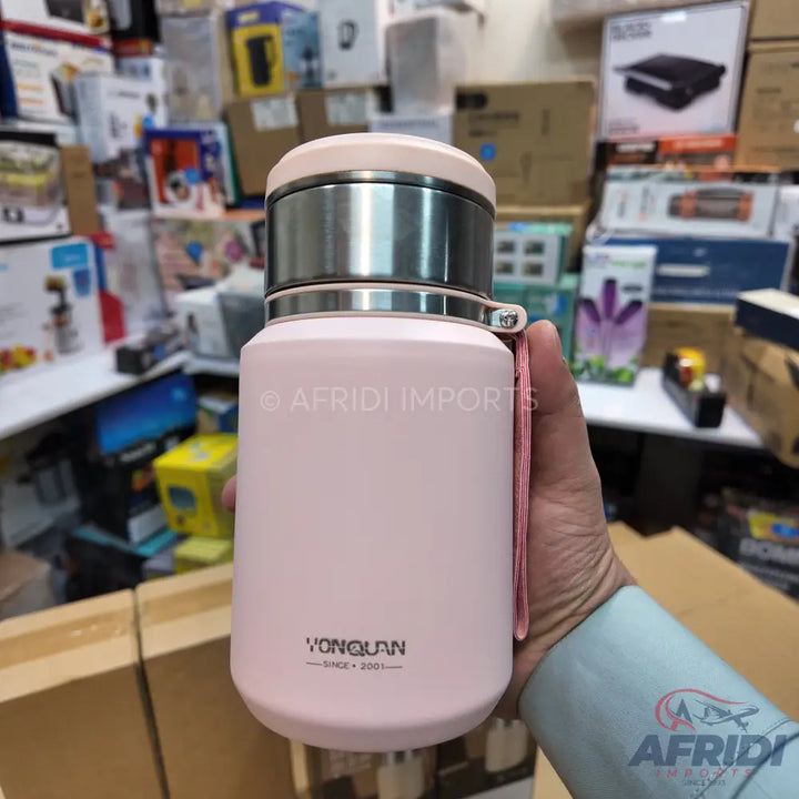 Pink stainless steel insulated water bottle with a strap.