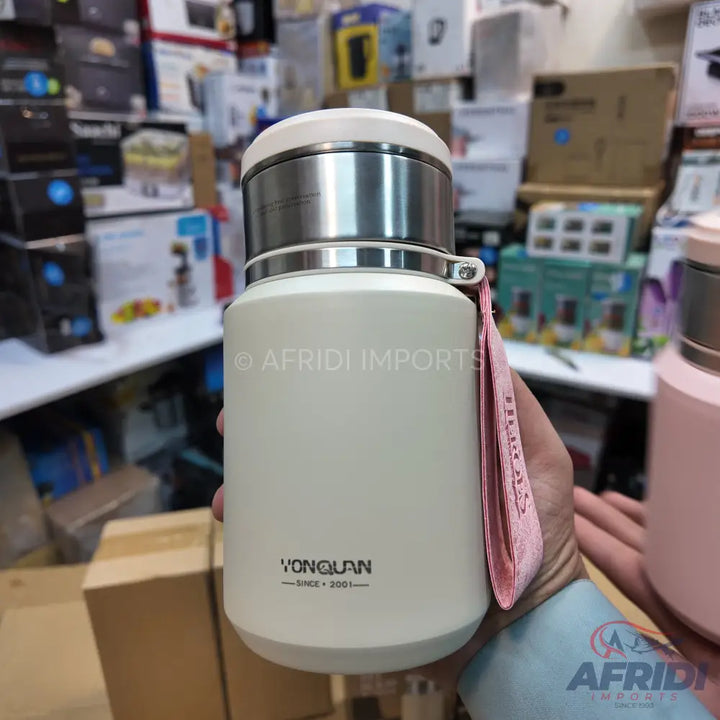 An off-white, cylindrical Yongquan thermos bottle with a stainless steel top and a pink fabric carrying strap.